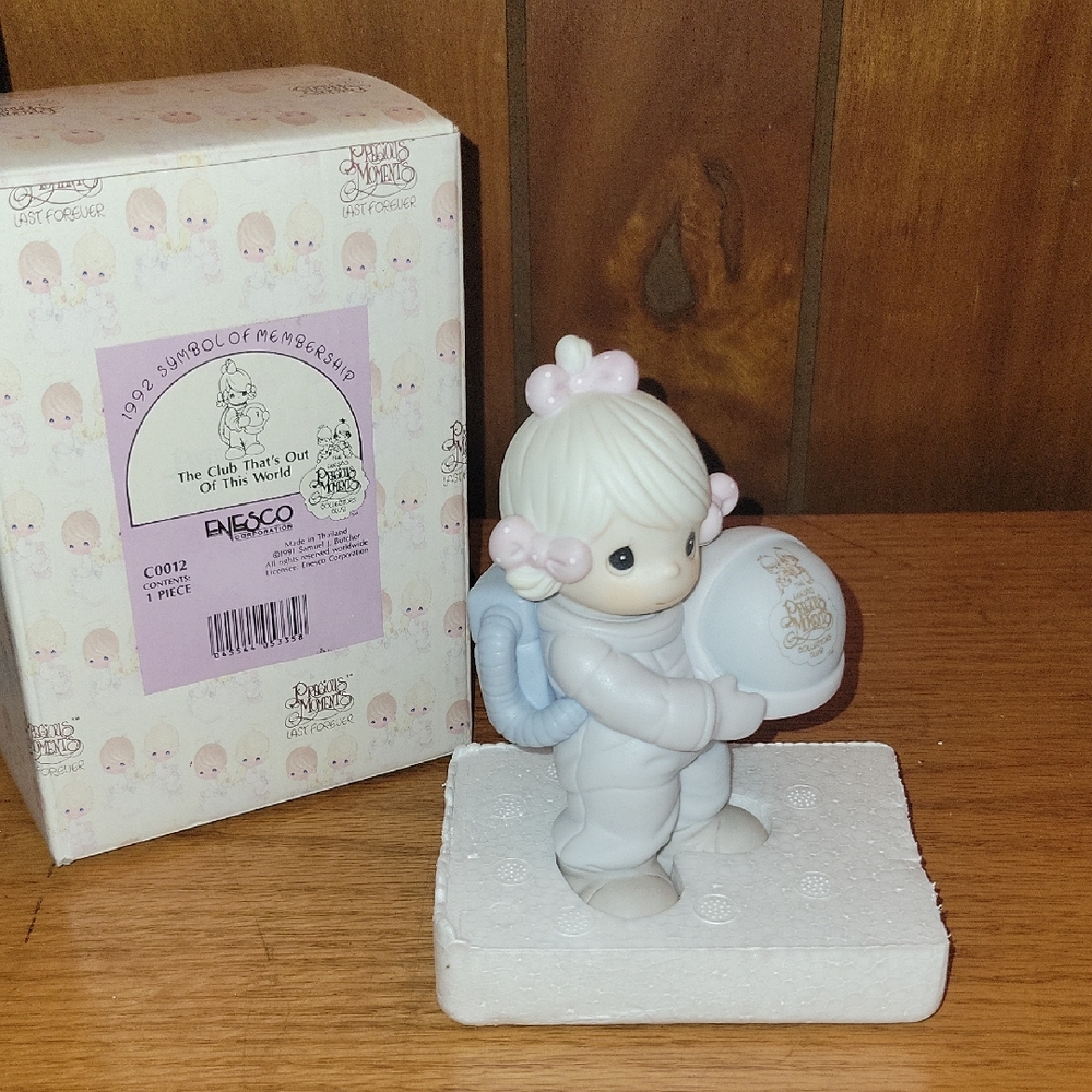 Precious Moments "The Club That's Out of This World" figurine.